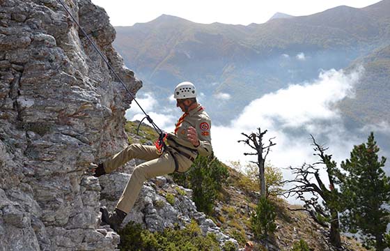 Rangers dancing by the fire at night